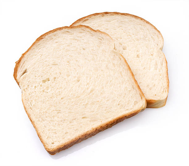 istock Two slices of sandwich bread isolated on white background 147043892