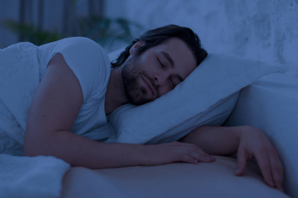 istock Peaceful young man sleeping in bed alone at home 1470440090