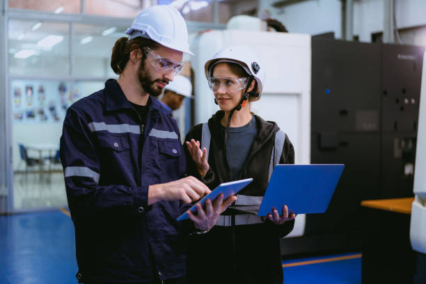 istock Professional technician checking and repairing part of automatic machine 1470440866