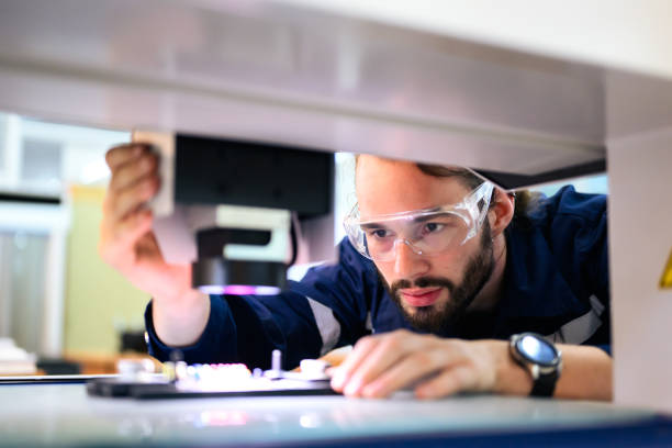 istock Professional technician checking and repairing part of automatic machine 1470441825