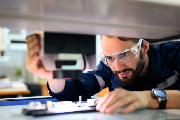 istock Professional technician checking and repairing part of automatic machine 1470441953