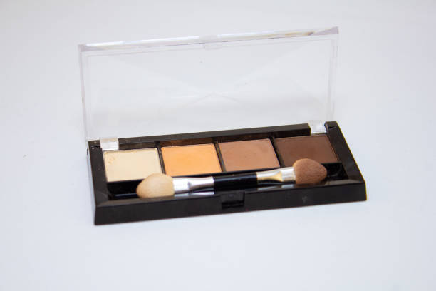 istock Eyeshadow palette on a white isolated background. Eye shadow for creating a caric makeup for a wife. Multi-colored eye shadows on a white background. Beauty and makeup concept. 1470442498