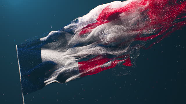 Full frame french flag made of colored sand breaking apart in partlicles