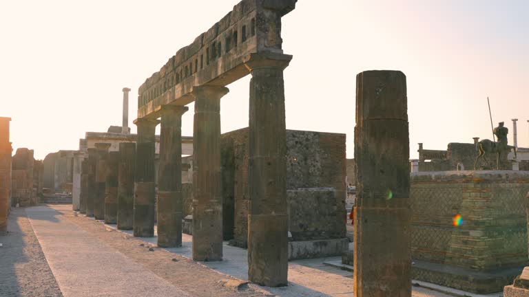 Pompeii, Italy. Amazing Sun Sunshine Through Through Remains Of Ancient Building On Territory Of Pompeii Forum. Sunlight During Sunset. Travel Italy