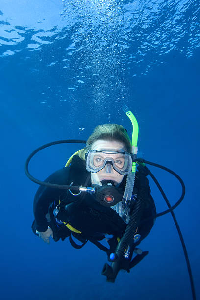 istock Woman scuba diving underwater 147044338