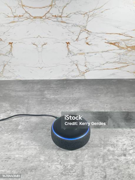 Amazon Alexa Smart Speaker On A Clean Modern Kitchen Surface Stock Photo - Download Image Now