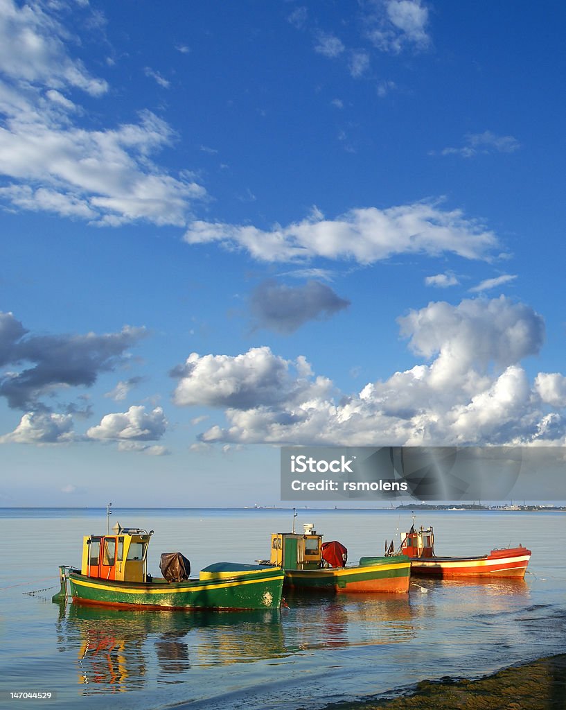 Fishing boats Baltic sea, three fisihng boats waiting near shore Coastline Stock Photo
