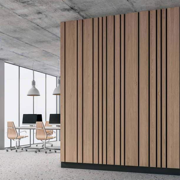 istock A side view of a semi-empty office interior with copy space and work desks on a terrazzo floor and hardwood beige paneled wall 1470445321