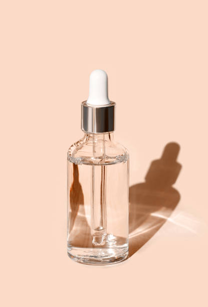 istock serum on beige background with natural shadow 1470446643