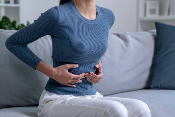 istock Woman suffering from strong abdominal pain. 1470446863