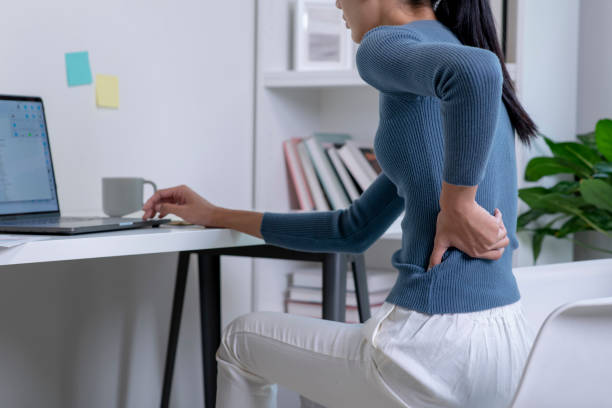 istock Asian young attractive woman pain with back pain ache from computer work. 1470446904