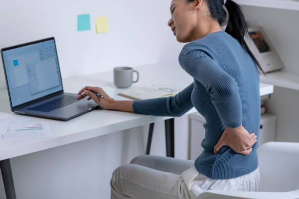 istock Asian young attractive woman pain with back pain ache from computer work. 1470446922