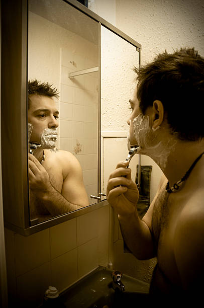 istock Man shaving in small bathroom 147044762