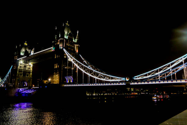 Tower Bridge light structures over the River Thames in London at night stock photo