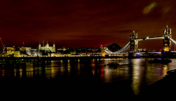 Nighttime old town panorama of London seen across the River Thames stock photo
