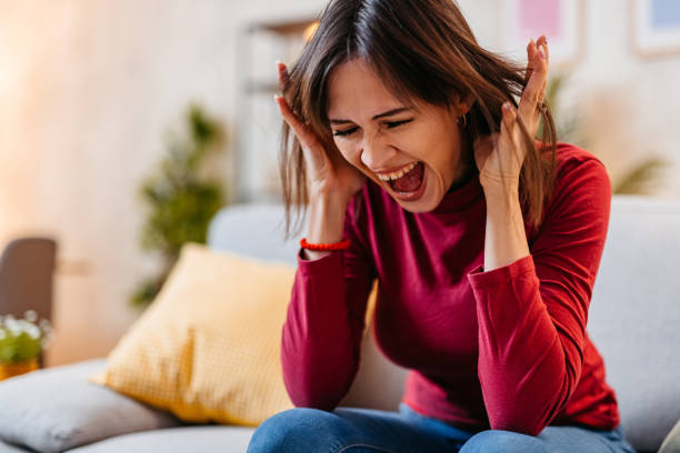 istock Depressed Young Woman Screaming At Home 1470448865