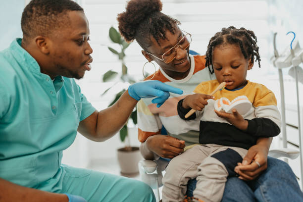 istock Doctor is showing brushing teeth 1470449034