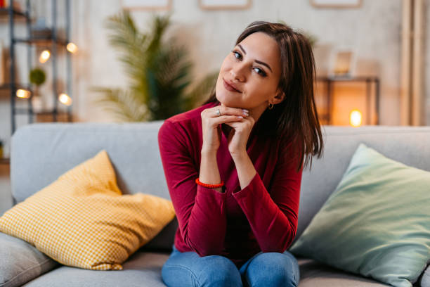 istock Young Woman Sitting On The Sofa At Home At Night 1470449059