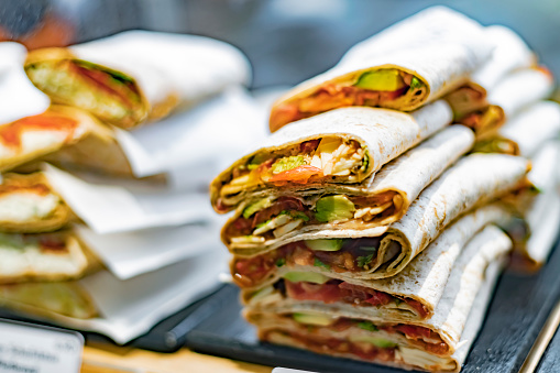 Freshly prepared tortilla wraps sold in a fast food restaurant.