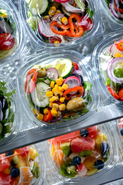 istock Boxes with pre-packaged vegetable salads in a commercial fridge 1470450284
