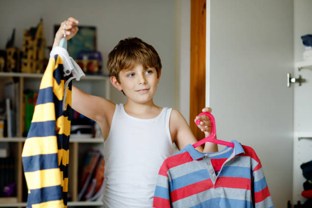 5,400+ Boy Choosing Clothes Stock Photos, Pictures & Royalty-Free ...