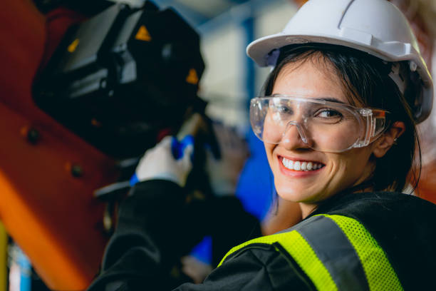 istock Professional maintenance worker with machine robotic arms at industrial factory 1470452150