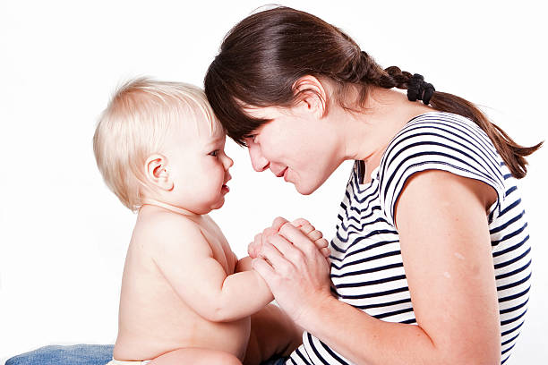 istock Happy mother with baby isolated on white background 147045348