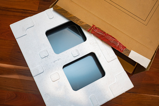 Modern computer monitor with polystyrene packaging