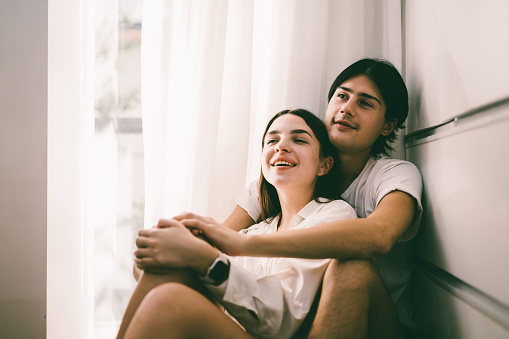 Couple of romantic young people spending time together on weekend at home, Boyfriend and girlfriend portrait, Vintage style photo