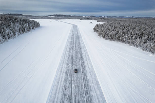 istock Car driving on icy road seen from above 1470457508