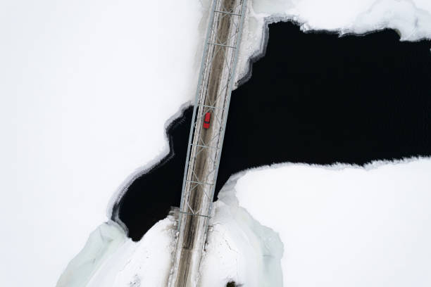istock Aerial view of car crossing bridge 1470457545