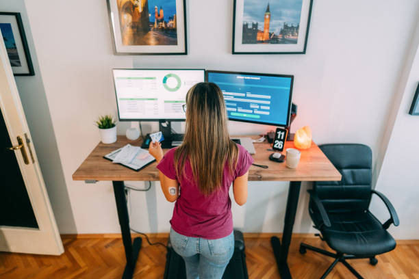 istock Woman working at standing desk 1470458184