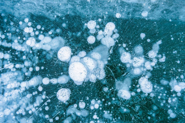 istock Natural ice bubbles on frozen lake in wintertime 1470460207