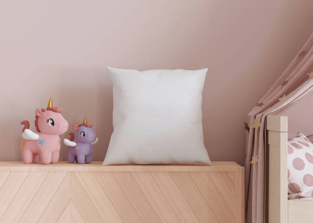istock White square pillow in kids room. Blank cushion case template for your graphic design presentation. Pillow cover mock up for print, pattern, personalized illustration. Close-up. 3D rendering. 1470460268