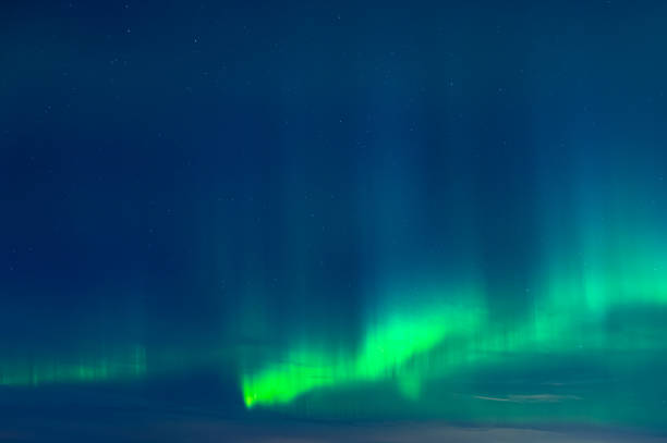 istock Green Aurora borealis on night sky 1470463241