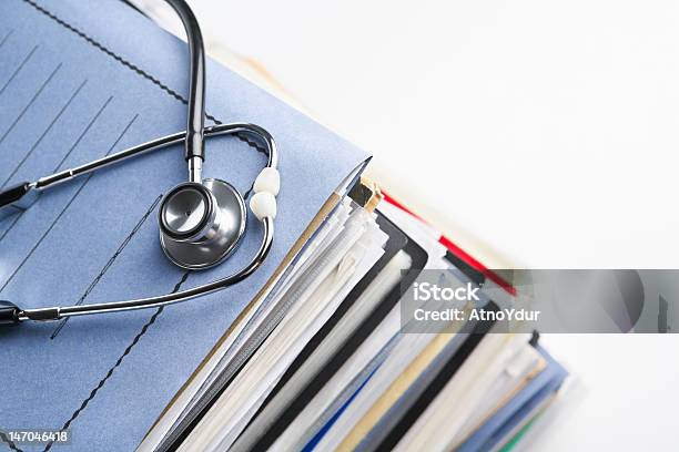 A Stack Of Medical Report Folders Stock Photo - Download Image Now - Copy Space, Document, File Folder