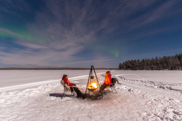 istock Couple around the fire under northern lights 1470464608