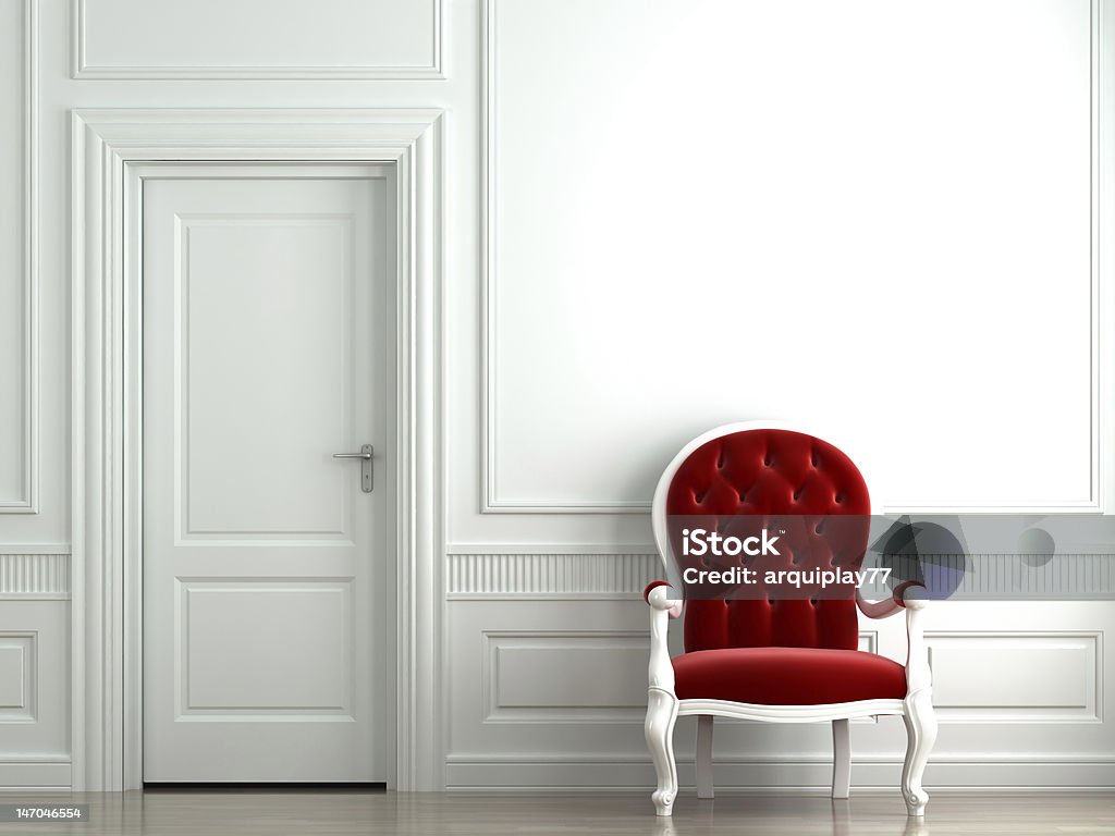 red velvet armchair on white wall red velvet armchair on classic white wall interior Red Stock Photo