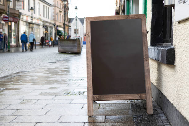 istock Blank chalkboard A-frame on a wet pavement in a Scottish high street 1470465862