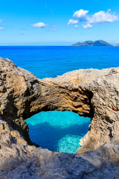 istock Natural hole rock formed in the bay. 1470467235