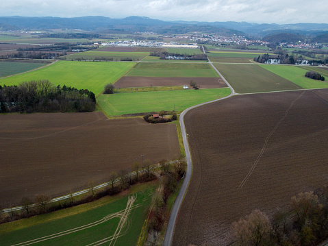 Green fields in Bavaria in the valley with aerial view in winter