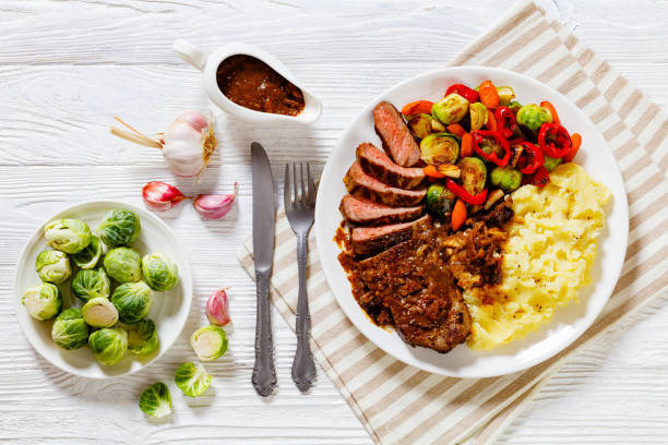 beef steak with potato mash and roasted vegetables