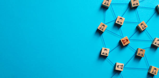 istock Organization structure, social network and teamwork concept on blue background. Business people icon on wooden cube blocks connecting network of connections 1470470340