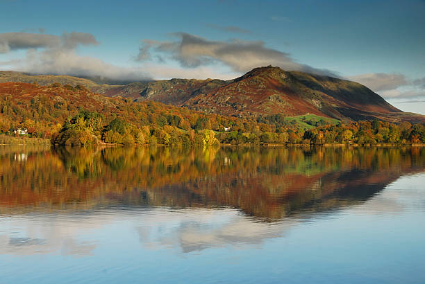 Grasmere in autumn, English Lake District Helm Crag, also known as the Lion and the Lamb, reflected in Grasmere in autumn in the English Lake District grasmere stock pictures, royalty-free photos & images