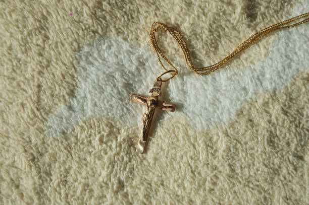 istock catholic gold cross on a chain. Easter, epiphany. background for the design 1470475469