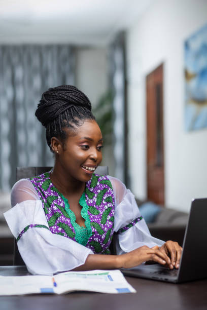istock African female university student learning for school exams, doing research  online. 1470476029