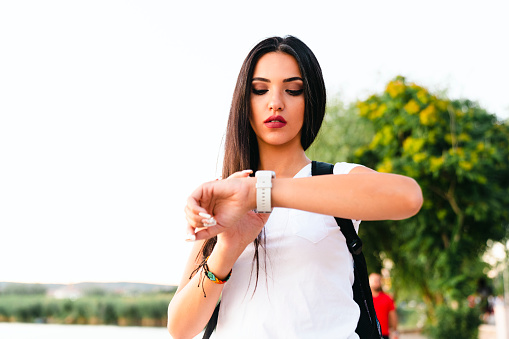 Young Woman Checking Heart Rate On Smart Watch
