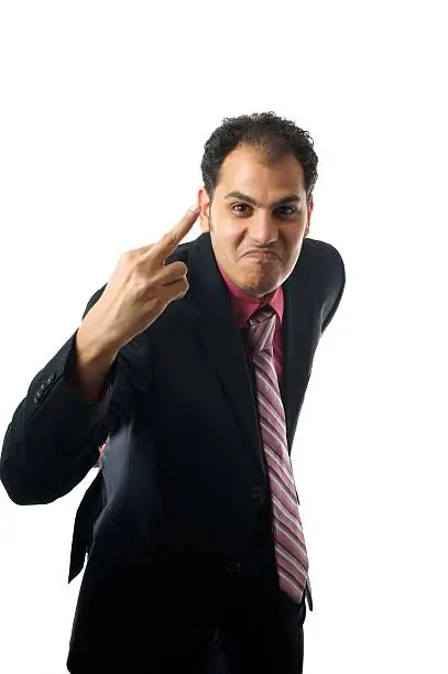 A business man is showing his middle-finger showing his dissatisfaction
