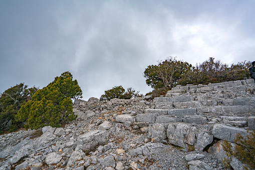The identification of Mnara with Marmara has generally been accepted at the site of Kavak Daği where it extends over the top and slopes at 1350 m, behind Kemer.