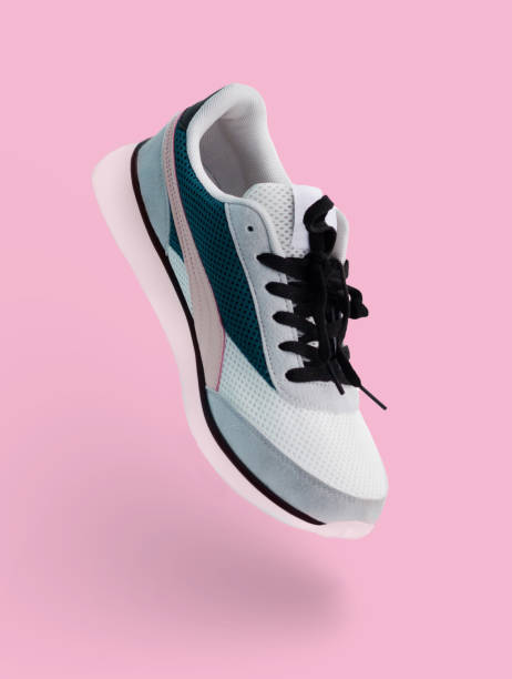 istock A flying sneaker on a pink background. Shoes for athletes 1470481475